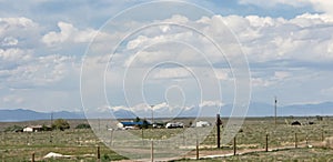 On the road again in Colorado with rocky mountains in the horizon