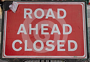 Road ahead closed sign on the street
