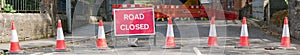 Road ahead closed sign and traffic cones