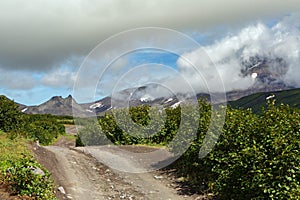 Road along dry river to Avachinskaya group Volcano on Kamchatka Peninsula