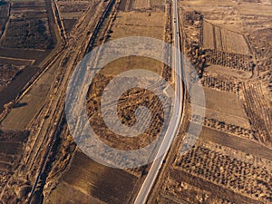 Road along fields at sunset