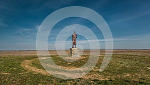 The road around the monument in the Kalmyk spring steppe