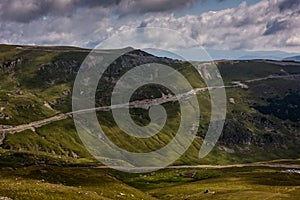 Road ascending high into the Carpathian mountains of Romania