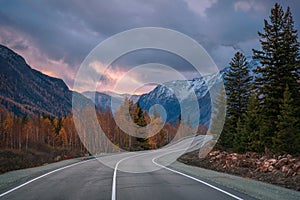 Road asphalt mountains sunset clouds sky autumn