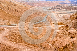 Road in the Atacama desert between salt formations at Valle de la Luna