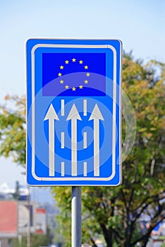 Road banner, sign with arrows directing to the EU flag