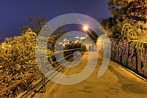 A road in the beautiful park Letna in Prague at night