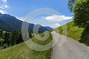 Road with a beautiful view. Santa Maddalena village, Dolomites, Val di Funes, Italy