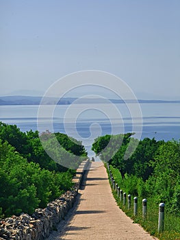 A road beckons to follow towards the sea