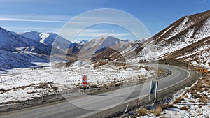 A road bend in snow covered New Zealand.