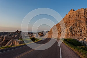 Road Bends Through Badlands Formations
