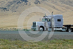 On the road, big grey truck in Colorado