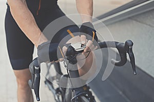 Road Bike Handle Bar With GPS Navigator and Smart Watches. Modern and Contemporary Gadgets on Sport Bicycle