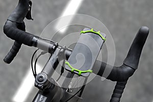 Road bike with smartphone on handlebars