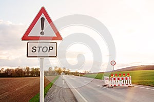 Road block with warning lights on road at countryside