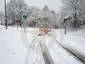 Road blocked due to heavy snowfall. Impassable road covered in snow in the German town of Heiligenhaus.