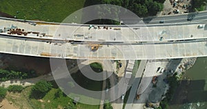 Road bridge construction. Aerial view of bridge construction over highway. View from above highway road repair. Building
