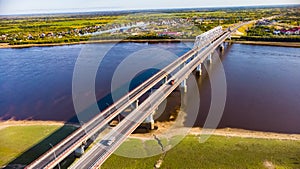 Road bridge over river in the city of oil and gas