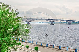 Road bridge over the Volga river between Saratov and Engels, Russia. Cloudy summer day. City quay