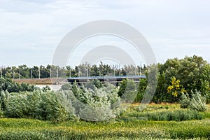 Road bridge passing through the field