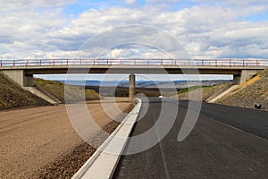 Road with bridge under construction