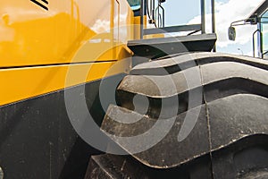 Road-building machinery, tractors yellow excavators in open air in working position