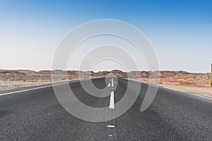 Road without cars in the Namibe Desert. Angola.