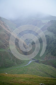 Road in Caucasus over mountain river
