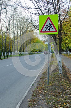 road with a caution sign children