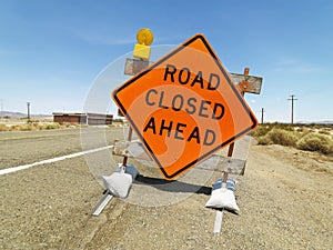 Road closed ahead sign.