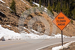 Road closed ahead sign