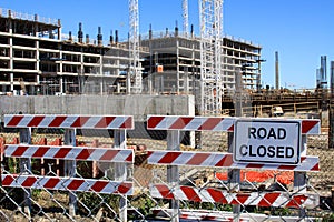 Road Closed Sign with Construction Site in the Background