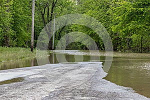 Road closed due to high water flooding roadway
