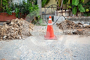 The road is closed. Repair. Overhaul of city road and tram line. Road plumbing work. Traffic cones on road  to divert traffic in d photo