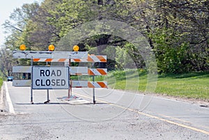 Road closed sign and barricade