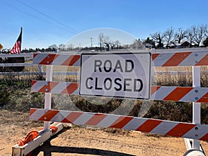 Road closed sign and barricade in the country