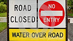 Road Closed Sign Due To Flood Water Over The Road