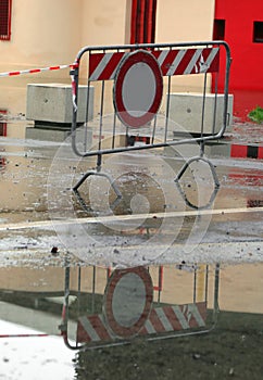 Road closed sign due to flooding after a citywide downpour