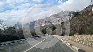 Road and clouds over mountains