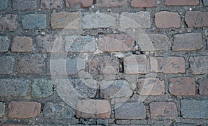 Road cobbles in grey and light reds