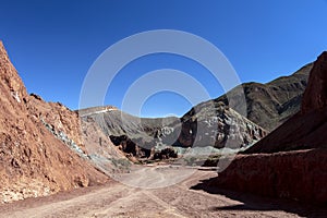 Road in the Rainbow Valley Valle Arco-Iris in the Atacama Desert of Chile, South America photo