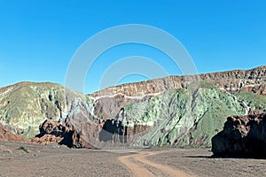 Road in the Rainbow Valley Valle Arco-Iris in the Atacama Desert of Chile, South America photo