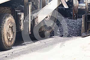 Road construction asphalt road by worker and roller machine. Asphalt road background