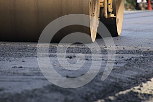 Road construction asphalt road by worker and roller machine. Asphalt road background