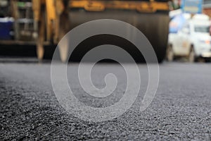 Road construction asphalt road by worker and roller machine. Asphalt road background