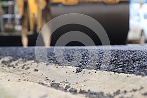 Road construction asphalt road by worker and roller machine. Asphalt road background