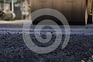 Road construction asphalt road by worker and roller machine. Asphalt road background