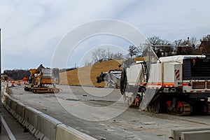 Road construction equipment are working on a new road construction repair route