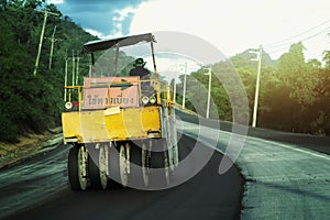 Road construction machinery Road maintenance workers with signs indicating indirect detour