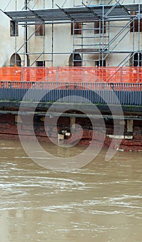 road construction site t to reinforce the river embankment in full flood